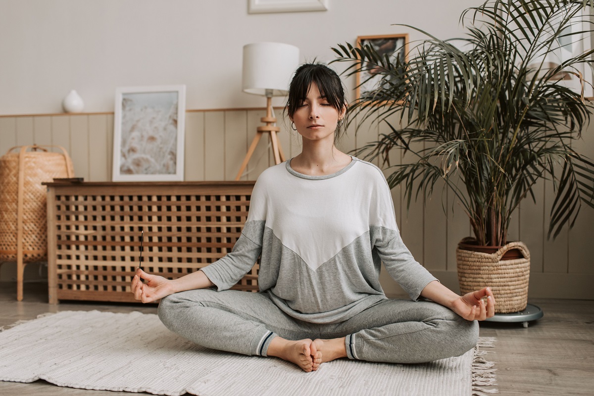 woman meditating in a wellness room